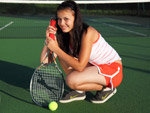 teenage girl playing tennis