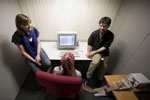 researchers recording EEG during a study with a participant