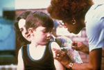 young child receiving a vaccine shot