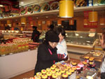 women at a grocery store