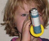 a child using an asthma inhaler