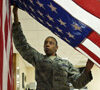 a military women holding the flag