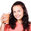 Fruit And Vegetable Concentrate Decreases Number Of Days With Severe Cold Symptoms a women with fruit juice