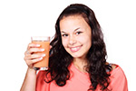 women-drinking-vegetable-fruit-juice-stock a women with fruit juice