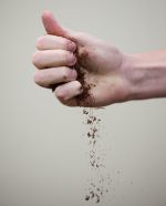 dirt dropping from a hand