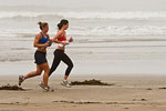 females jogging on the beach