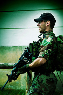 military soldier with machine gun